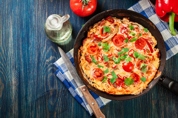 Frittata made of eggs, sausage chorizo, red pepper, green pepper