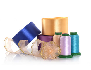 Fototapeta na wymiar Satin ribbons, silk threads and gold braid. Everything for sewing and needlework
