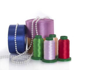 Satin ribbons, silk threads, pearls. Everything for sewing and needlework
