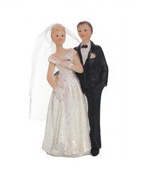 Bride and groom, old cake topper on white background