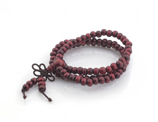 Wooden rosary on a white background. Isolated