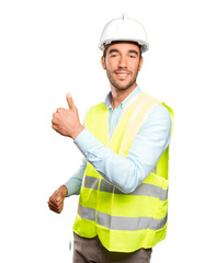 Happy engineer with an okay gesture against white background