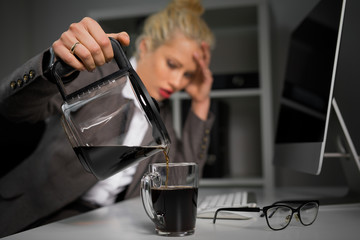 Woman pouring coffee in cup