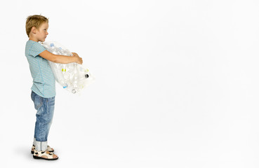 Ecology little boy holding bag of plastic bottle for recycle