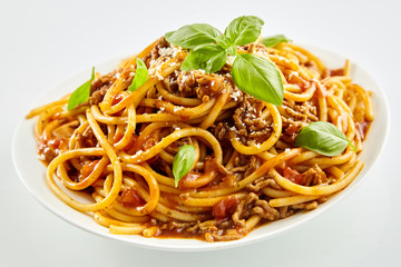 Spaghetti noodles with Bolognese sauce and basil