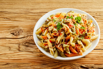 Bowl of healthy wholewheat penne rigate noodles