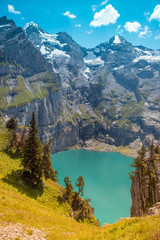 Fototapeta na wymiar Beautiful magical landscape with the lake Oeschinensee in the Swiss Alps, near Adelboden, Switzerland, Europe