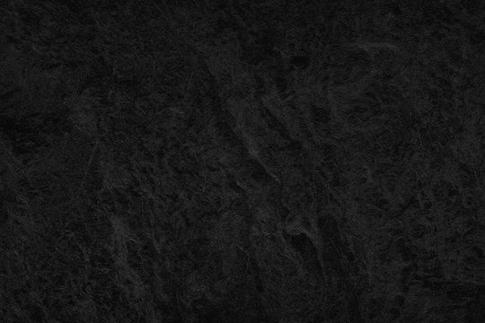 Black Stone background. Dark gray texture close up high quality May be used blank for design. Copy space