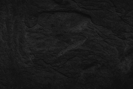 Black Stone background. Dark gray texture close up high quality May be used blank for design. Copy space