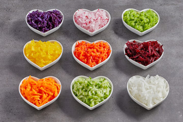 Little bowls with grated vegetables