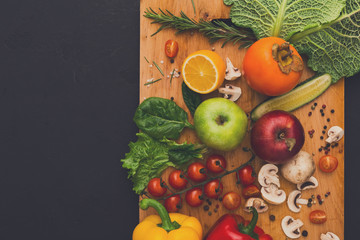 Frame of fresh vegetables on wooden background with copy space