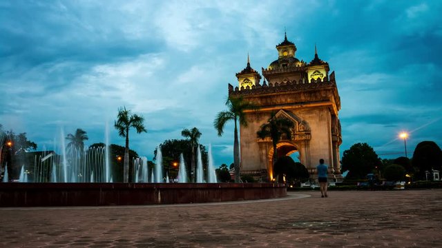 Vientiane, Laos. Patuxay park at night with illuminated Gate of Victory - famous landmark in Vientiane, Laos. Time-lapse at sunset
