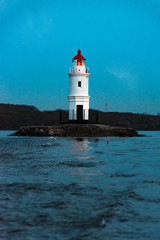 Lighthouse at sea at dusk