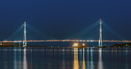 Fototapeta na wymiar Night view of the bridge in the city of Vladivostok on the island of Russian