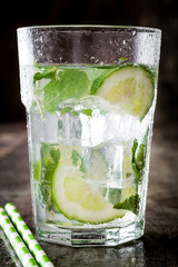 Mojito cocktail in glass on wooden background

