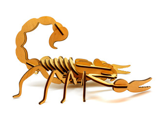 Statuette of wooden scorpion isolated on a white background