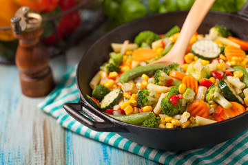 Mix of vegetables fried in a wok.