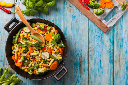 Fototapeta Mix of vegetables fried in a wok.