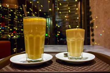 Two glasses of coffee in cafe