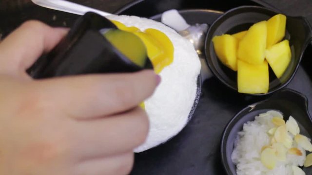 Woman Topping Mango Sauce On Dessert, stock video