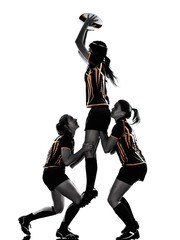 Obraz premium rugby women players team in silhouette isolated on white backround