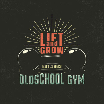 Old-school dumbbells with inscriptions and a sunberst - a vintage poster for the gym. Grunge texture on separate layers and can be easily disabled.