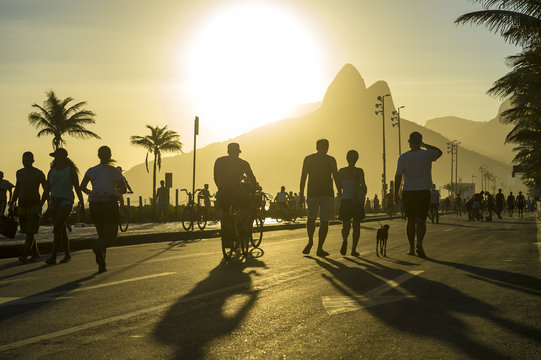 Bright scenic view of the Ipanema Beach boardwalk on a golden sunset afternoon in Rio de Janeiro, Brazil