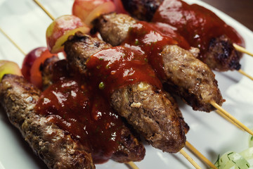 Luleh kebab ,traditional east dish. ethnic style. selective focus.caucasian Luleh kebab with vegetable,caucasian Luleh kebab