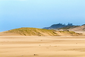 Heavy Wind  Blowing Sand on Beach Against Coastal Skyline