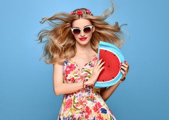 Fashion Beauty woman in Summer Outfit. Sensual Sexy Blond Model in fashion pose Smiling. Trendy Floral summer Dress, Stylish wavy hairstyle, fashion Flower Hairband. Playful Happy Romantic summer Girl