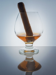Glass whisky brandy cognac Cuban cigar background light gradient luster