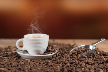 Cup of coffee with coffee beans
