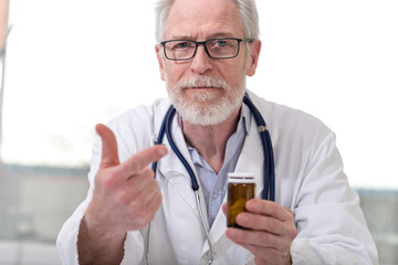 Portrait of doctor prescribing medication