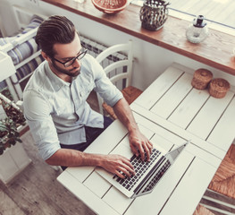 Businessman working in cafe