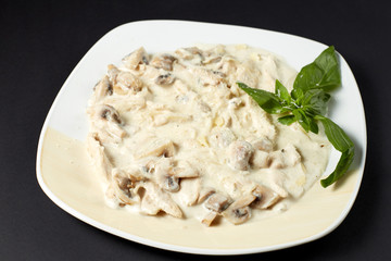 Chicken fillet with mushrooms in creamy sauce. Italian style. Italian food. Italian cuisine.