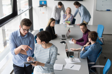 Two Business People Working With Tablet in office