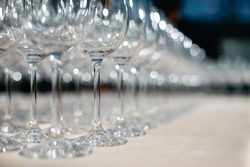 Close up picture of empty glasses on the beige tablecloth  in restaurant