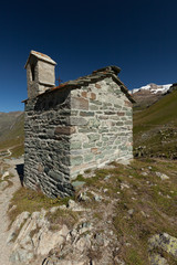 Small chapel in mountains. Italian Alps