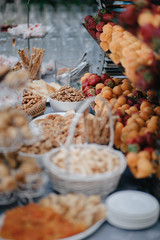 Vertical shot of wedding candy bar with nuts, fruits and pastry