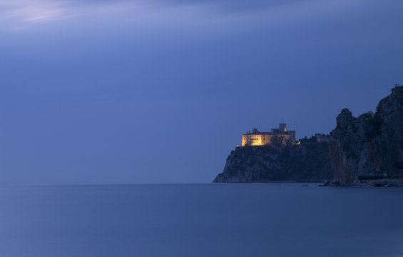  The Duino castle at blue hour from Porto Piccolo's beach in Sistiana, Trieste, Italy
