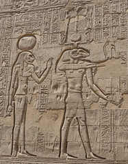 Hieroglyphic carvings on an ancient egyptian temple wall