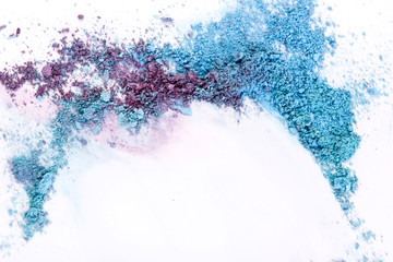 Makeup background, eyeshadow sprinkled on white