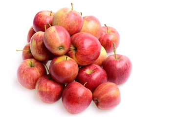 many red apples, fresh fruit background in market