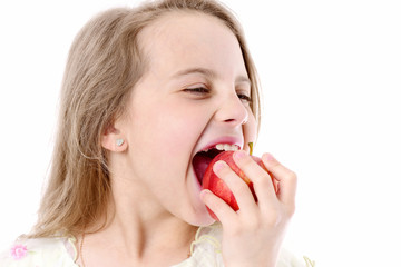 cute happy girl eating red apple isolated on white
