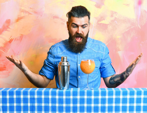 Brutal caucasian hipster with tropical alcohol fresh cocktail