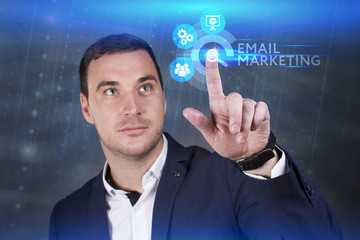 Business, Technology, Internet and network concept. Young businessman working on a virtual screen of the future and sees the inscription: Email marketing