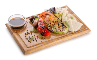 Fototapeta na wymiar grilled vegetables on a wooden background