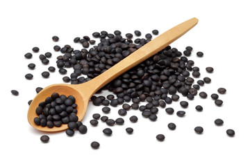 Black lentil with wooden spoon