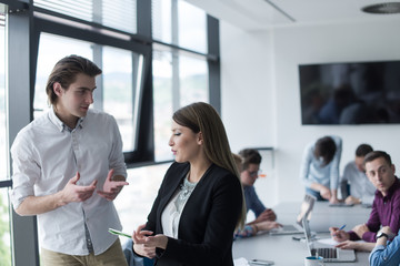 Fototapeta premium Two Business People Working With Tablet in office