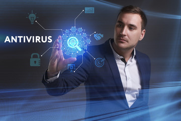 Business, Technology, Internet and network concept. Young businessman working on a virtual screen of the future and sees the inscription: Antivirus